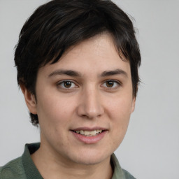 Joyful white young-adult female with medium  brown hair and grey eyes