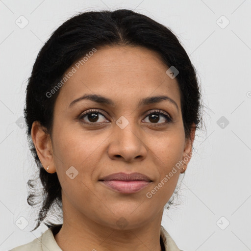 Joyful latino adult female with medium  brown hair and brown eyes