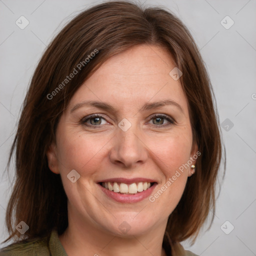 Joyful white adult female with medium  brown hair and grey eyes