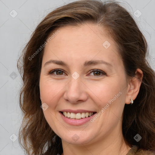 Joyful white adult female with long  brown hair and brown eyes