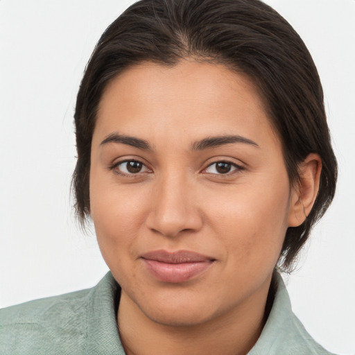 Joyful latino young-adult female with medium  brown hair and brown eyes