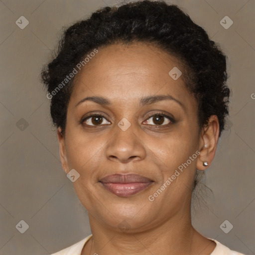 Joyful black adult female with short  brown hair and brown eyes