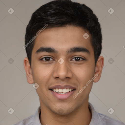 Joyful latino young-adult male with short  black hair and brown eyes