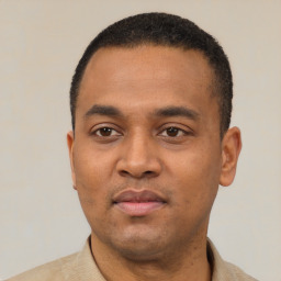 Neutral black young-adult male with short  black hair and brown eyes