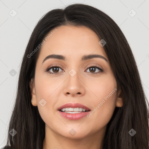 Joyful latino young-adult female with long  brown hair and brown eyes