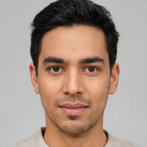 Neutral latino young-adult male with short  black hair and brown eyes