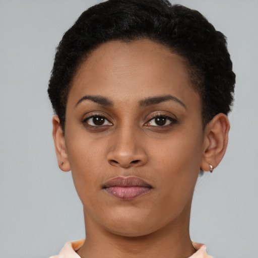 Neutral latino young-adult female with short  brown hair and brown eyes