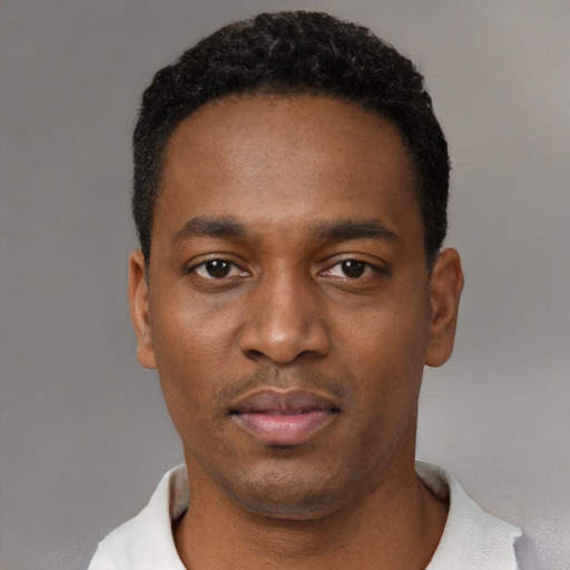 Neutral black young-adult male with short  black hair and brown eyes