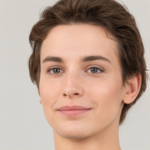 Joyful white young-adult female with short  brown hair and grey eyes