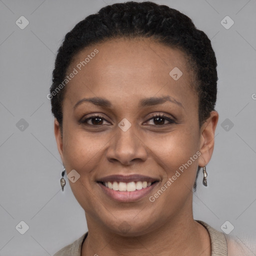 Joyful black young-adult female with short  brown hair and brown eyes