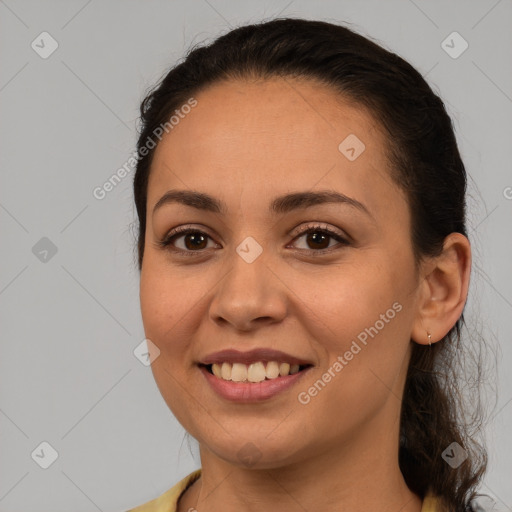 Joyful white young-adult female with long  brown hair and brown eyes