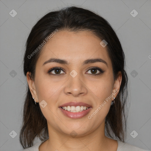 Joyful latino young-adult female with medium  brown hair and brown eyes