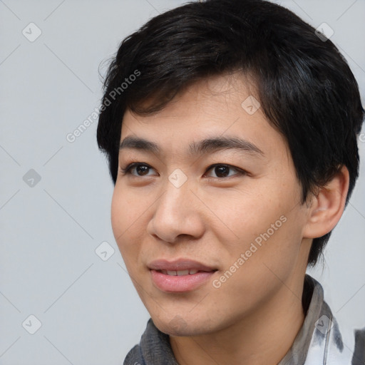 Joyful asian young-adult male with short  black hair and brown eyes