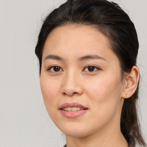 Joyful white young-adult female with medium  brown hair and brown eyes