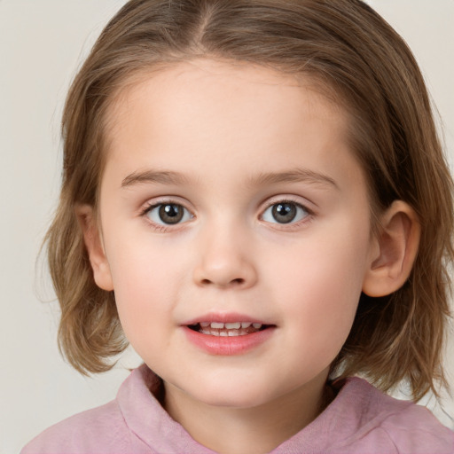 Joyful white child female with medium  brown hair and blue eyes