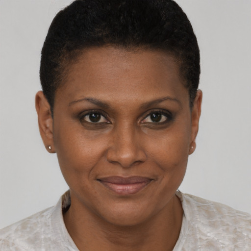 Joyful black young-adult female with short  brown hair and brown eyes