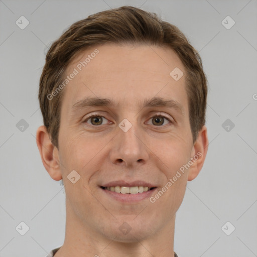 Joyful white adult male with short  brown hair and grey eyes