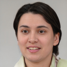 Joyful white young-adult female with medium  brown hair and brown eyes