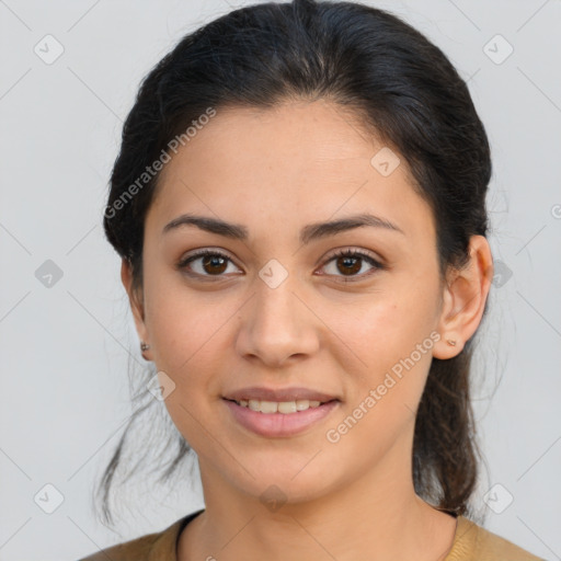 Joyful latino young-adult female with medium  brown hair and brown eyes