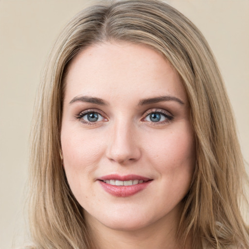 Joyful white young-adult female with long  brown hair and green eyes