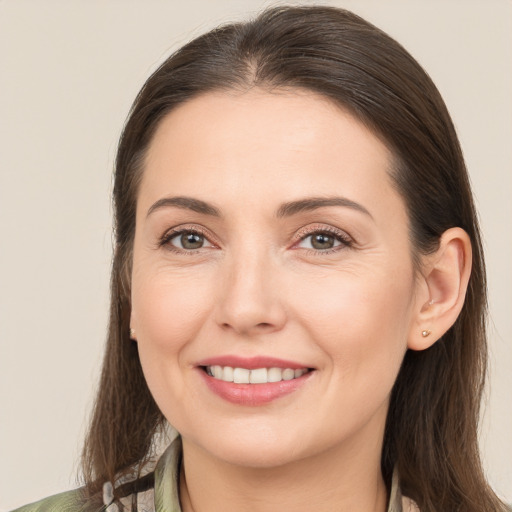 Joyful white young-adult female with medium  brown hair and brown eyes