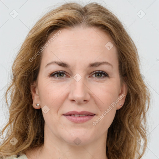 Joyful white adult female with long  brown hair and brown eyes