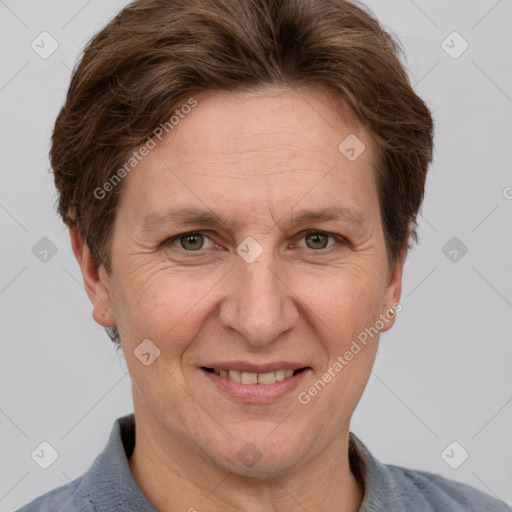 Joyful white adult female with short  brown hair and grey eyes