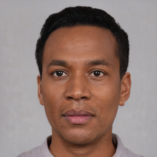 Neutral black young-adult male with short  black hair and brown eyes