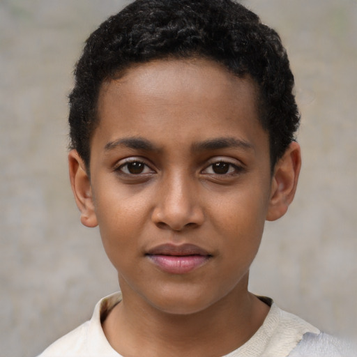 Joyful black child female with short  brown hair and brown eyes