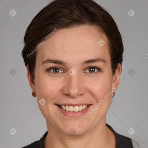 Joyful white young-adult female with short  brown hair and grey eyes