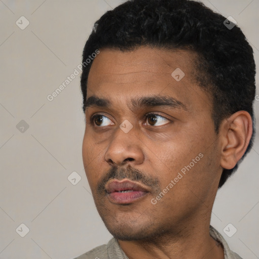 Neutral latino young-adult male with short  black hair and brown eyes