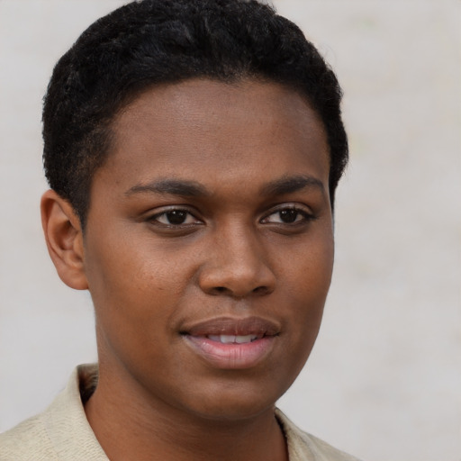 Joyful black young-adult female with short  brown hair and brown eyes