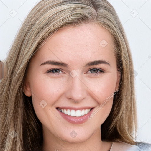 Joyful white young-adult female with long  brown hair and blue eyes