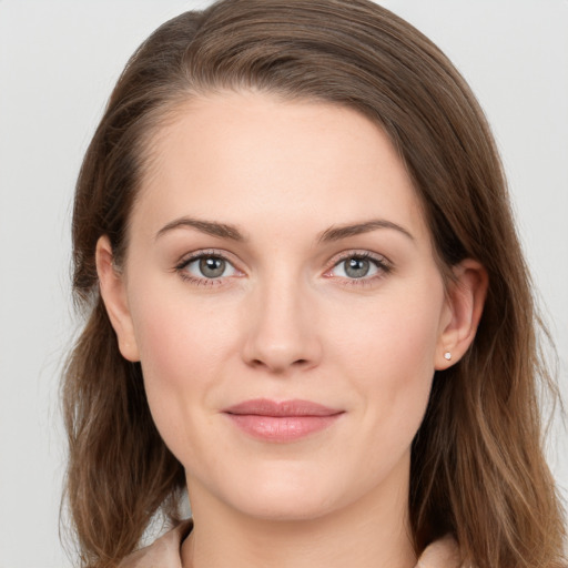 Joyful white young-adult female with long  brown hair and grey eyes