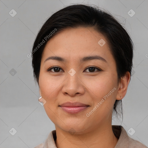 Joyful asian young-adult female with medium  brown hair and brown eyes