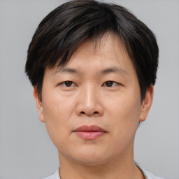 Neutral asian young-adult male with short  brown hair and brown eyes