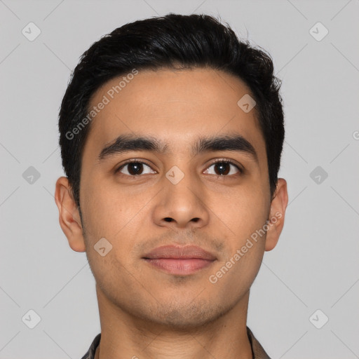 Joyful latino young-adult male with short  black hair and brown eyes