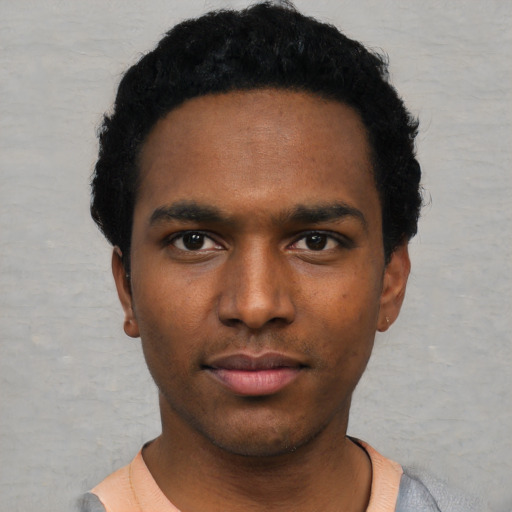 Neutral black young-adult male with short  black hair and brown eyes