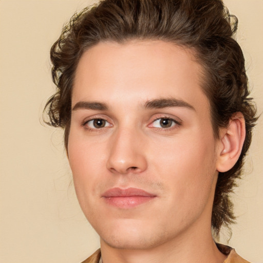 Joyful white young-adult male with medium  brown hair and brown eyes