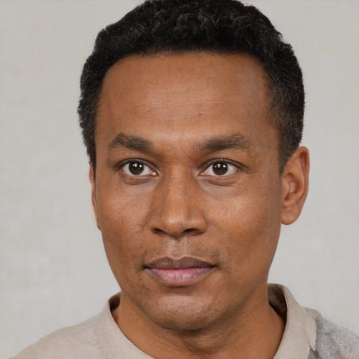Neutral latino adult male with short  black hair and brown eyes