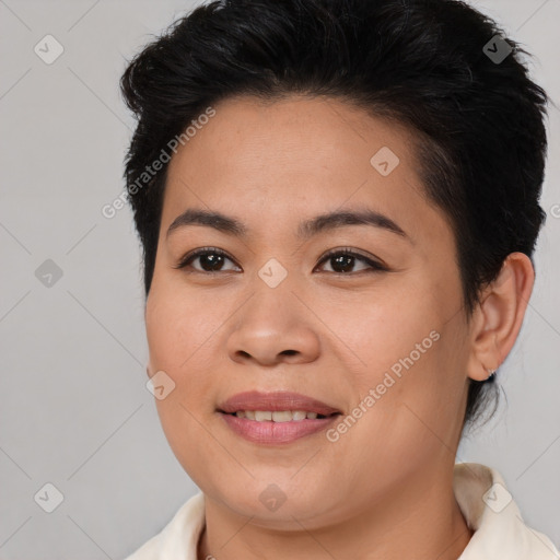 Joyful asian young-adult female with short  brown hair and brown eyes