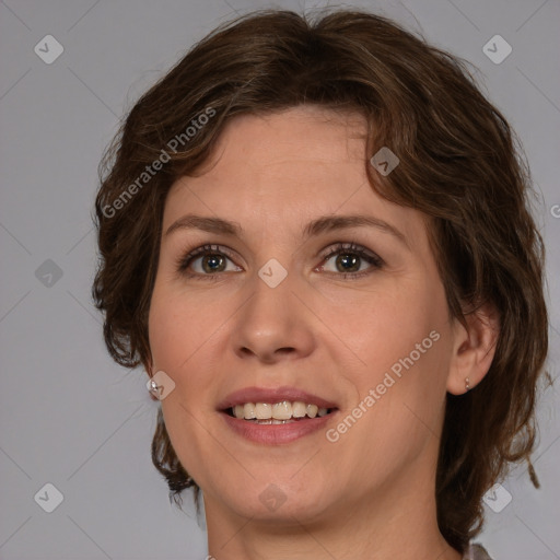 Joyful white young-adult female with medium  brown hair and green eyes