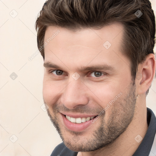 Joyful white young-adult male with short  brown hair and brown eyes