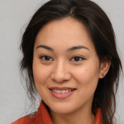 Joyful asian young-adult female with medium  brown hair and brown eyes