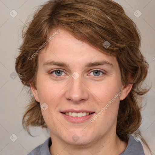 Joyful white young-adult female with medium  brown hair and blue eyes