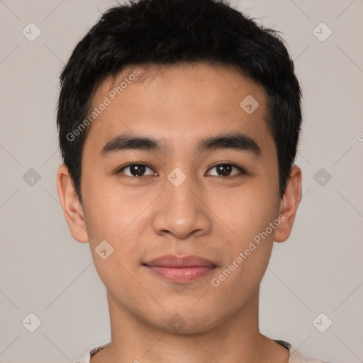 Joyful asian young-adult male with short  black hair and brown eyes