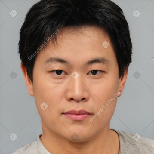 Neutral asian young-adult male with short  brown hair and brown eyes