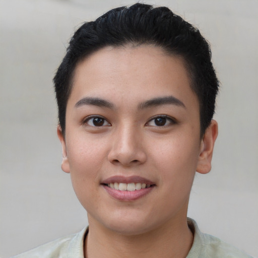 Joyful asian young-adult female with short  black hair and brown eyes