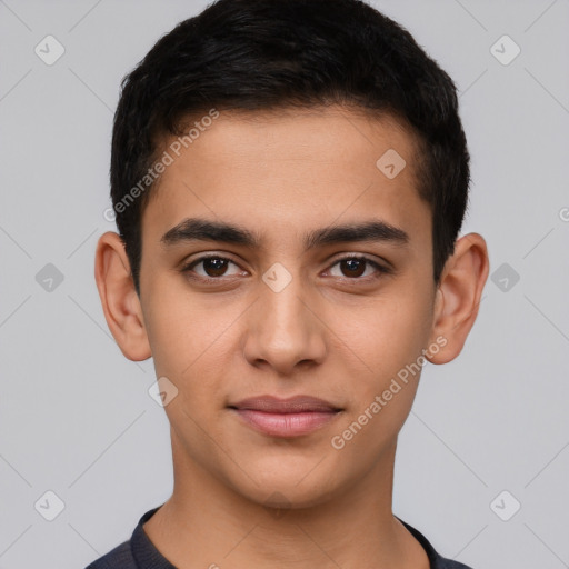 Joyful latino young-adult male with short  brown hair and brown eyes