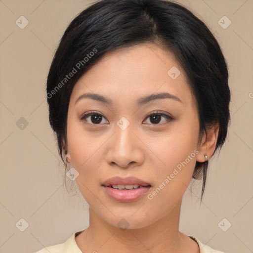 Joyful asian young-adult female with medium  black hair and brown eyes